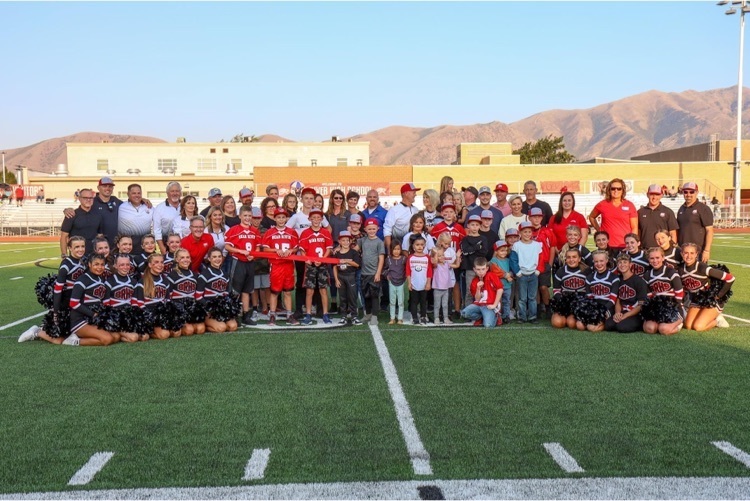 large group picture at the 50 yard line with BRHS gold, silver, and bronze level sponsors  
