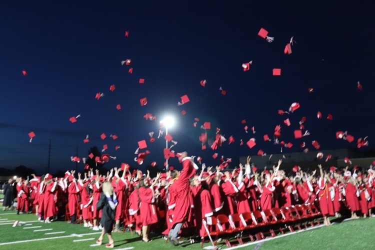 graduates throwing hats 